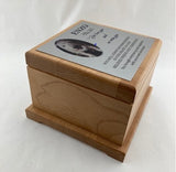 Wooden memorial urn with engraved plate and photo of dog