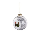 Clear round ornament with silver ribbon inside and photo of man and his dog