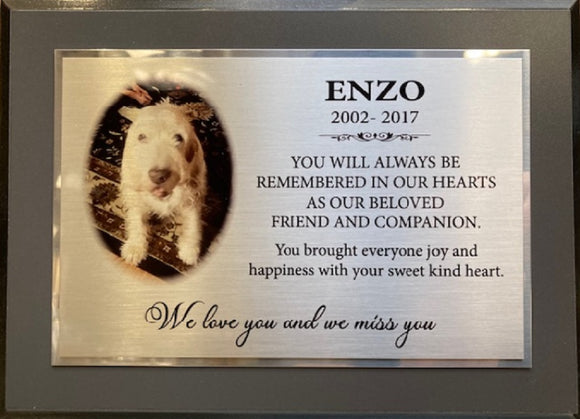 Memorial plaque with photo of dog and quote