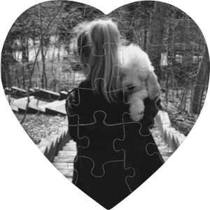 Photo of woman carrying a dog on a 20-piece heart-shaped puzzle