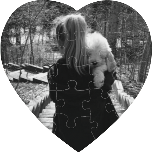 Photo of woman carrying a dog on a 20-piece heart-shaped puzzle